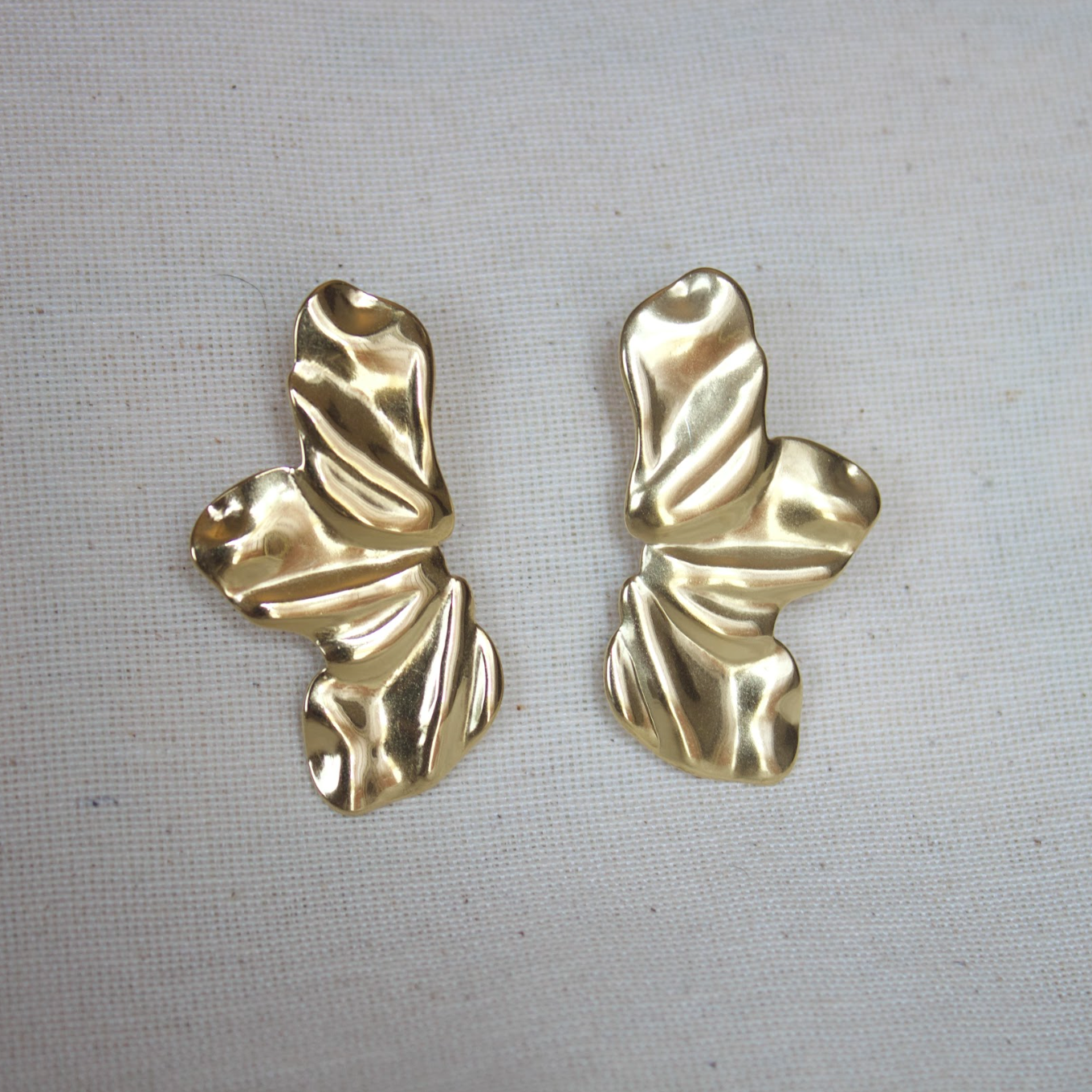 Aretes largos media flor