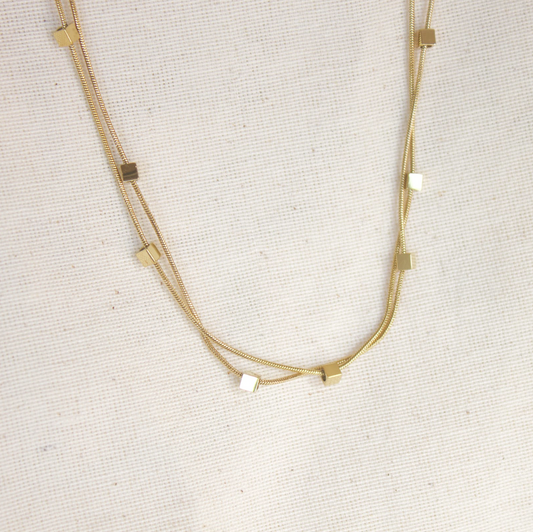 Collar doble cadena dorada con cubos